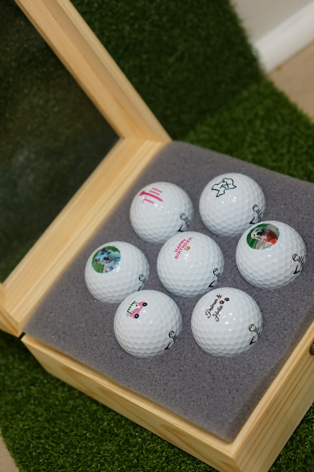 Wooden display box with seven golf balls